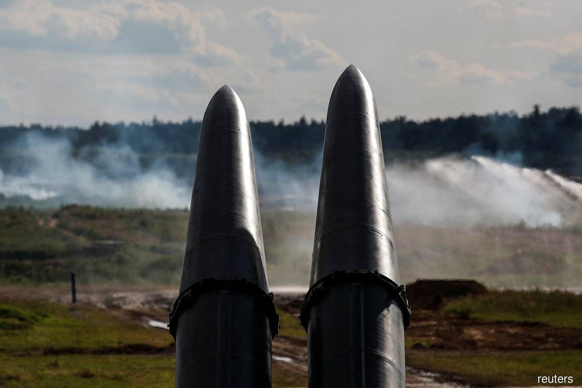Russian missiles rain down on military sites across Ukraine, say local officials